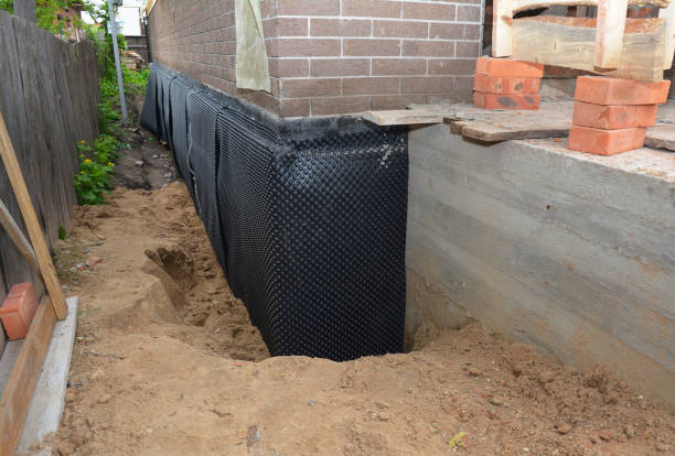 SJ Waterproofing Pros technician performing targeted Exterior Waterproofing assessment in Fremont, IN